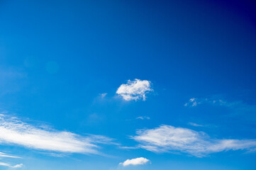 Naklejka na ściany i meble Blue sky with scattered blue clouds