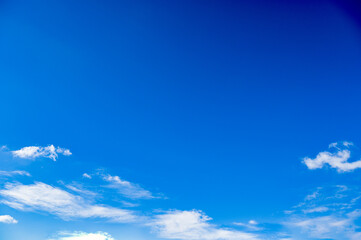 Blue sky with scattered blue clouds