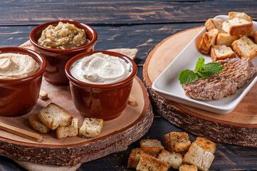.Meze is an oriental set of appetizers served in small bowls with babaganush, curd, hummus and kibbeh