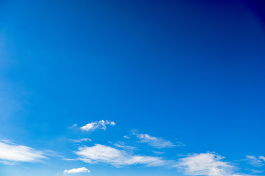 Blue sky with scattered blue clouds