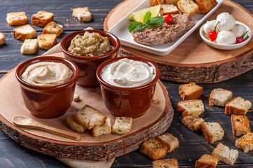 .Meze is an oriental set of appetizers served in small bowls with babaganush, curd, hummus and kibbeh