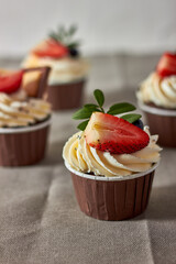 Cupcake decorated with strawberries and blueberries
