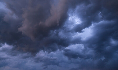 Naklejka na ściany i meble Beautiful dramatic storm sky with dark clouds, thunderstorm