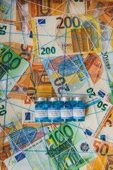 Concept for economy, finance, budget, investment and business, New year 2021, Covid-19 vaccination over the world, Euro banknotes
