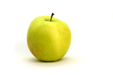 A green apple on a white background is isolated