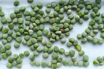 Close-up of peas microgreens. Planting microgreen peas.Germination of seeds at home. Sprouted seeds, micro greens.Vegan and healthy eating concept.