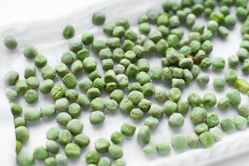 Close-up of peas microgreens. Planting microgreen peas.Germination of seeds at home. Sprouted seeds, micro greens.Vegan and healthy eating concept.