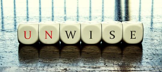  word "Unwise" or "wise" 