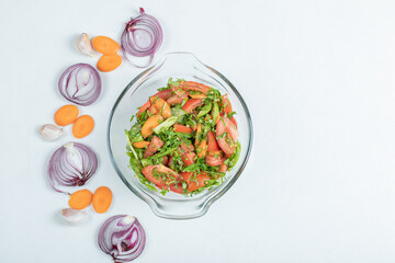 A glass plate of delicious vegetable salad
