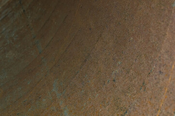 rust on the iron surface of a large pipe - abstract background