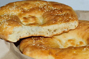 Close-up - fresh fragrant tortilla, divided into parts against the background of a whole tortilla