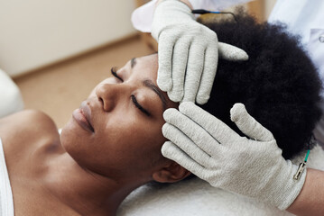 Face rejuvenation with the help of microcurrent therapy. Lymphatic drainage massage. Micro sensory...
