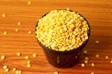 split pigeon peas  Organic Toor Dal in Bowl, Selective Focus with Blur Background