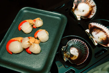 scallops separated from their shells. fresh seafood. ready to cook
