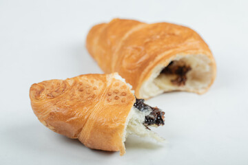 Croissant with chocolate filling on a white background