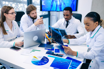 international team of professional doctors having a meeting in c