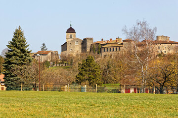 PEROUGES, FRANCE, February 23, 2021 : Far view of the old medieval town. The town was restored and houses were saved in the beginning of 20th century and is now a popular tourist attraction.