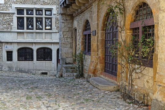 PEROUGES, FRANCE, February 23, 2021 : A street of the old medieval town. The town was restored and houses were saved in the beginning of 20th century and is now a popular tourist attraction.