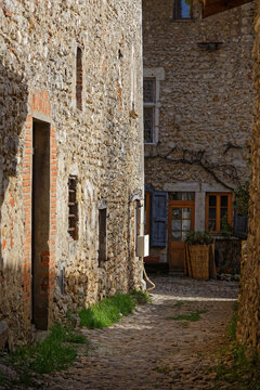 PEROUGES, FRANCE, February 23, 2021 : A street of the old medieval town. The town was restored and houses were saved in the beginning of 20th century and is now a popular tourist attraction.