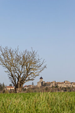 PEROUGES, FRANCE, February 23, 2021 : Far view of the old medieval town. The town was restored and houses were saved in the beginning of 20th century and is now a popular tourist attraction.