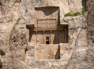 Sandstone rock with carved tombs of persian kings in Necropolis, Iran. King burial site of ancient Persia. Zoroastrian temple.