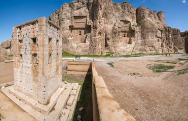 Sandstone rock with carved tombs of persian kings in Necropolis, Iran. King burial site of ancient Persia. Zoroastrian temple.