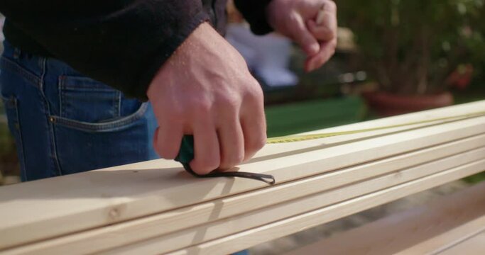 The stacked wood planks are decently measured and marked