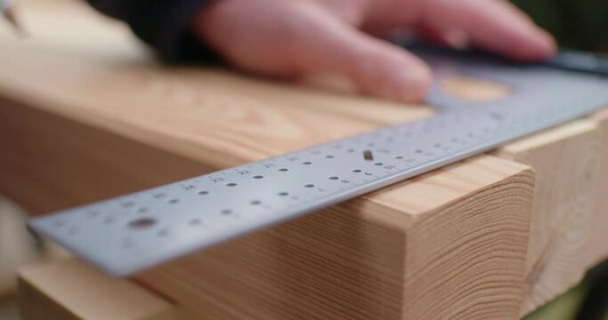 Measuring up the wood with a triangle ruler