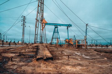 Oil pump industrial machine for petroleum on the background of dry earth © Emil