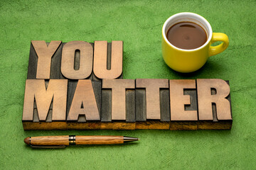 You matter reminder - inspirational word abstract in vintage letterpress wood type with a cup of...