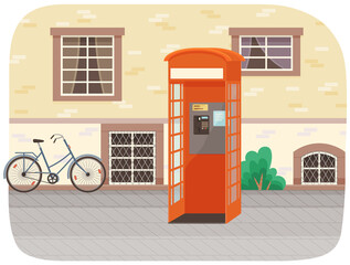 Empty London red classic telephone booth with an open door on the street with a bicycle at the building. City summer landscape with public telephone and brick wall with windows, Empty urban street