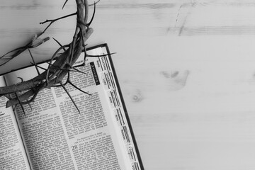 Black and white crown of thorns and open bible