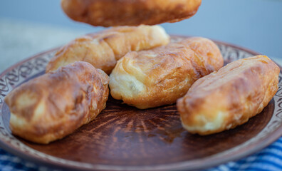 Homemade delicious pastries on a brown plate