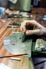 Hand of an artisan Making Handmade Jewelry