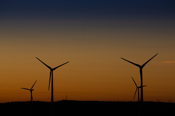 Wind turbines as part of the beautiful landscape at the golden hour