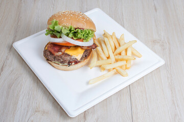 Traditional hamburger of beef, tomato, lettuce, onion and cheese