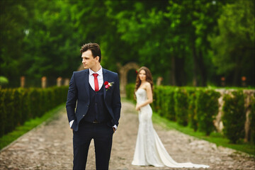 Stylish groom waiting for the meeting with her bride. Couple before the wedding ceremony