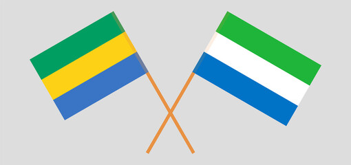 Crossed flags of Gabon and Sierra Leone. Official colors. Correct proportion