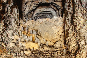 Fascinating ice formations and icicles in Chlum limestone quarry and caves,Czech Republic.Cave system in Cesky kras, Czech Karst.Freezing day outdoors.Wild natural winter scenery.Day trip from Prague.
