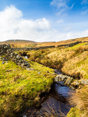 Obraz premium Dead Mans Hill, with open moorland, dry stone walls and stream. Nidderdale. Yorkshire Dales National Park