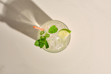 Mojito cocktail on white marble table. Top view with copy space for your text.