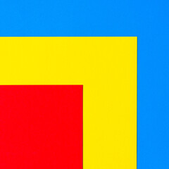 A multi-colored abstract background. Red yellow blue geometric background