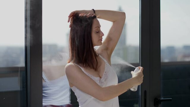 Beautiful woman using antiperspirant for freshers day,skincare routine