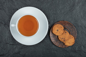 A cup of aroma tea with delicious cookies