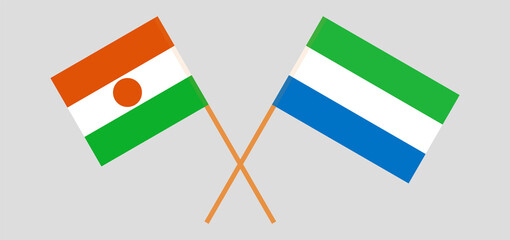 Crossed flags of Niger and Sierra Leone. Official colors. Correct proportion