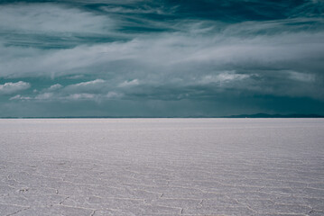 Fototapeta na wymiar Beautiful Bolivia's Salt Flats. Shot in Salar de Uyuni salt flat. Water reflection of clouds and empty space. 