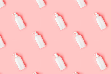 Creative seamless pattern from plastic bottle on pastel pink background. 