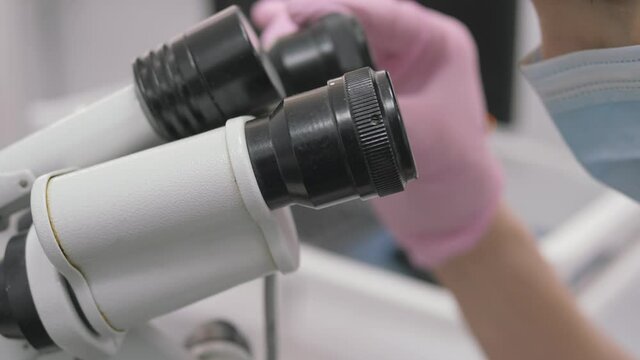 Obstetrician and gynecologist. Examination under a colposcope.