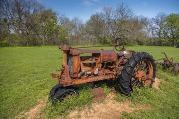 Old rusty tractor in a field