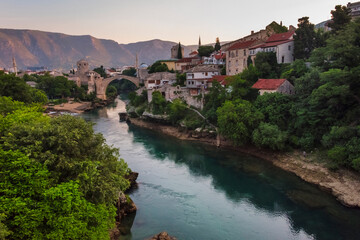 Fototapeta na wymiar Houses and Stari Most (Old Bridge) along the Neretva River, Mostar, Bosnia and Herzegovina